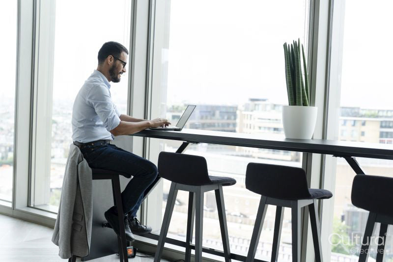 Businessman with laptop working in modern office