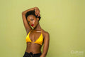 Studio portrait of woman in yellow bikini top