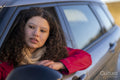 Young woman looking out of car window
