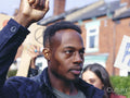 Protestor with hand raised