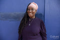 Portrait of beautiful woman with dreadlocks wearing a headscarf