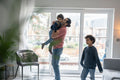 Father and sons playing at home