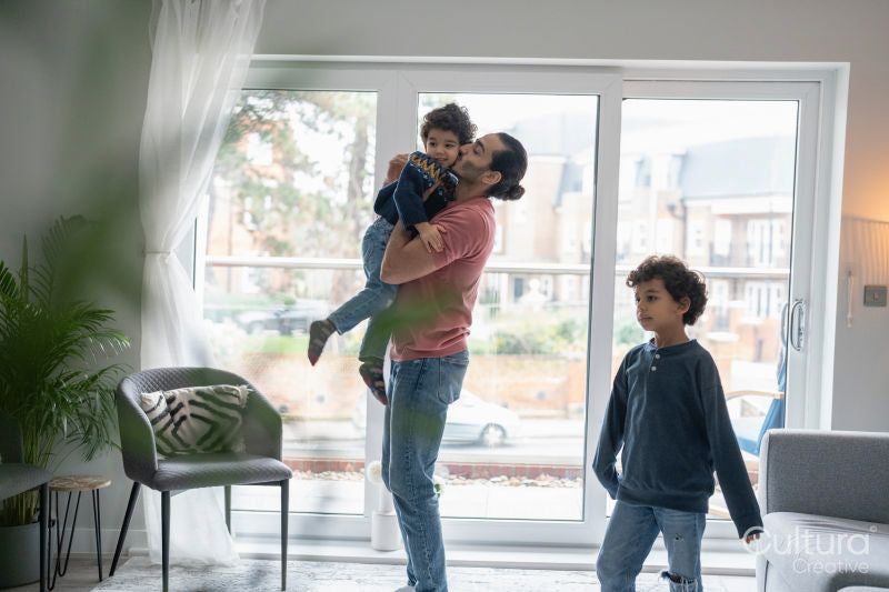 Father and sons playing at home