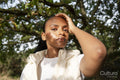 Portrait of woman in sunlight outdoors