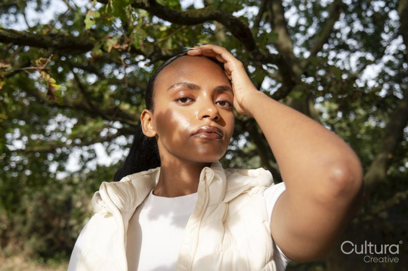 Portrait of woman in sunlight outdoors