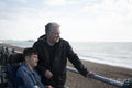 Portrait of father and son by the sea