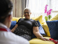 Nurse meeting patient at her home