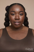 Studio portrait of young woman with braided hair