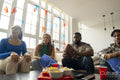 Friends watching sport game on TV at home