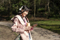 Young woman using phone in park