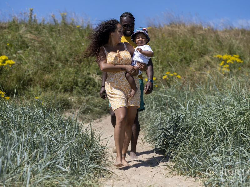 Family with baby son going to beach