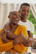 Portrait of mother and son embracing