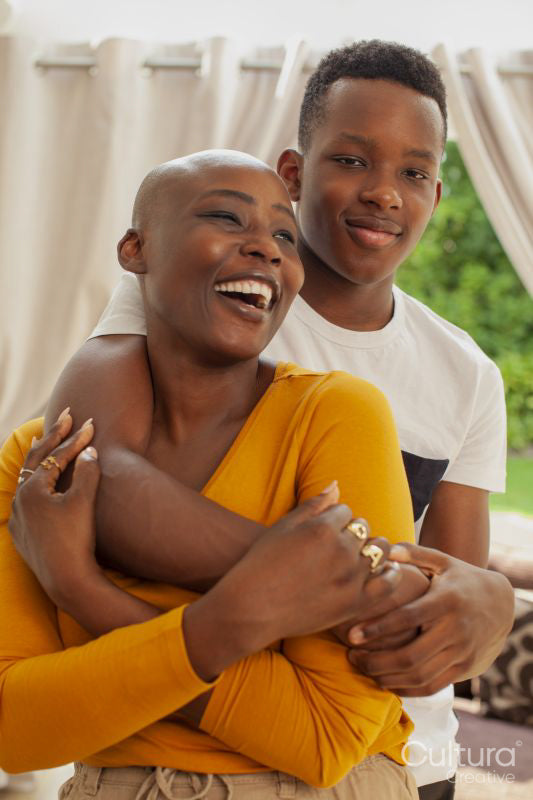 Portrait of mother and son embracing