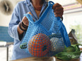 Woman holding grocery bag,close up