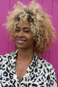 Smiling woman with curly hair