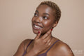 Studio portrait of smiling woman wearing bra