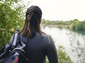 Rear view of woman in wetsuit