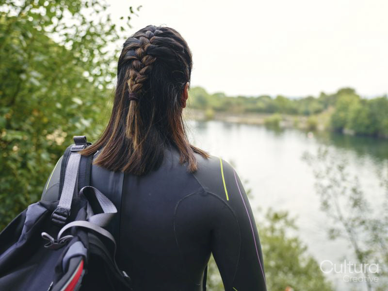 Rear view of woman in wetsuit