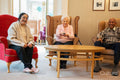 Senior people watching tv in nursing home