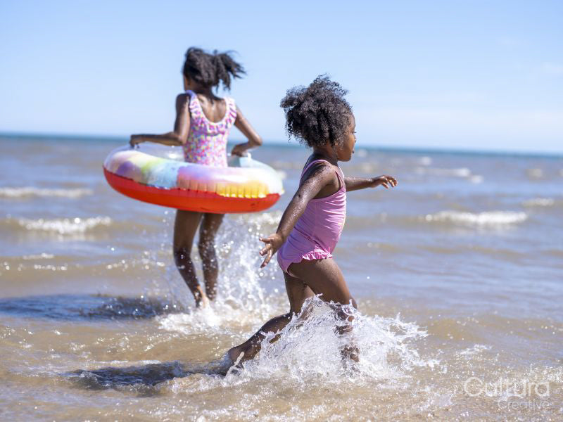 Sisters playing in sea