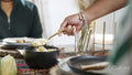 Woman serving food during Kwanzaa meal