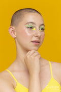 Studio portrait of girl with neon colored make-up