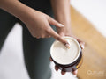 Close-up of woman holding jar with body balm