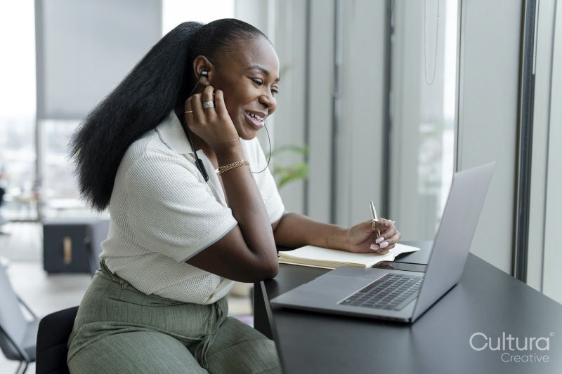 Businesswoman with laptop working in modern office