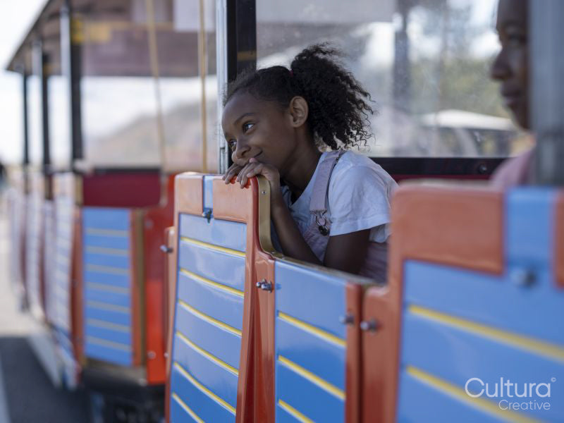 Girl on land train tourist ride
