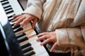 Senior woman playing piano