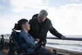 Portrait of father and son by the sea
