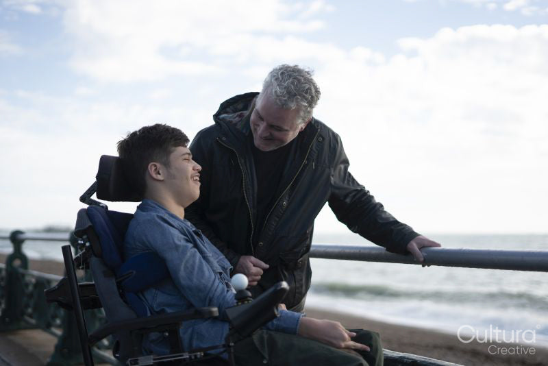 Portrait of father and son by the sea