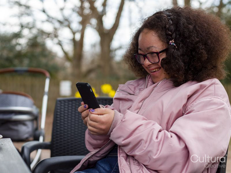 Girl holding mobile phone