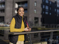 Young woman using phone in urban setting