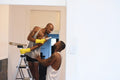 Louisiana, couple flirting while refurbishing apartment