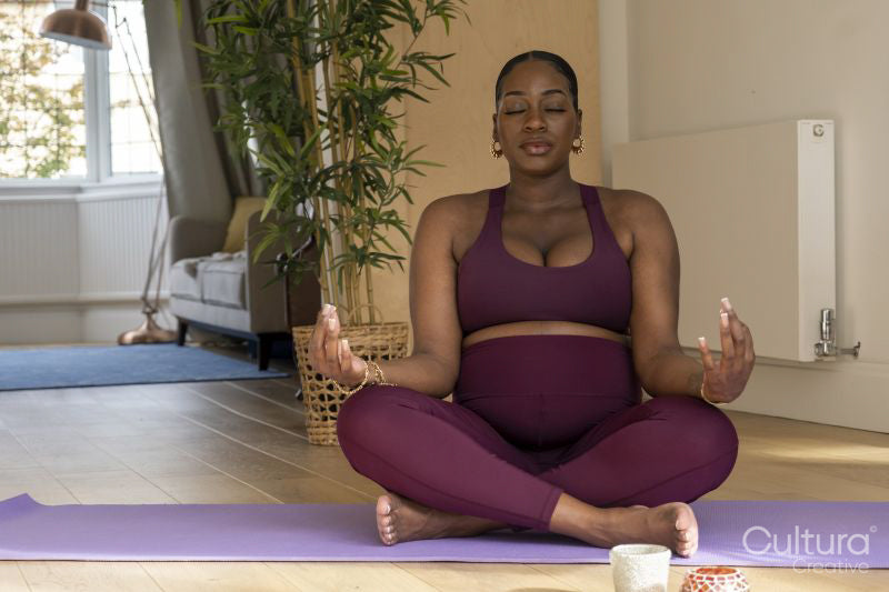 Pregnant woman practicing yoga