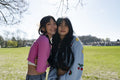 Portrait of young female friends in park
