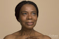 Studio portrait of mature woman with braided hair