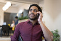 Businessman talking on phone in office