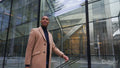 Business man outside office building