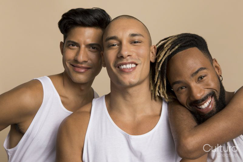 Studio portrait of men in white tank tops
