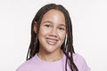 Studio portrait of smiling girl with braided hair