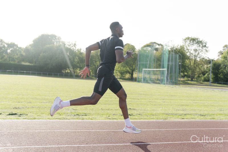 Athlete sprinting at running track