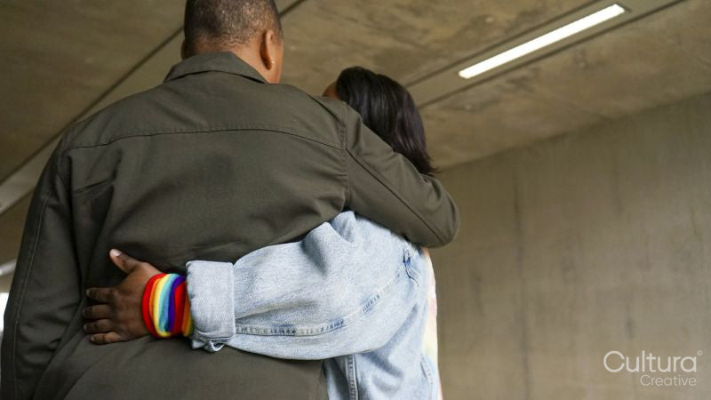 Rear view of two women embracing