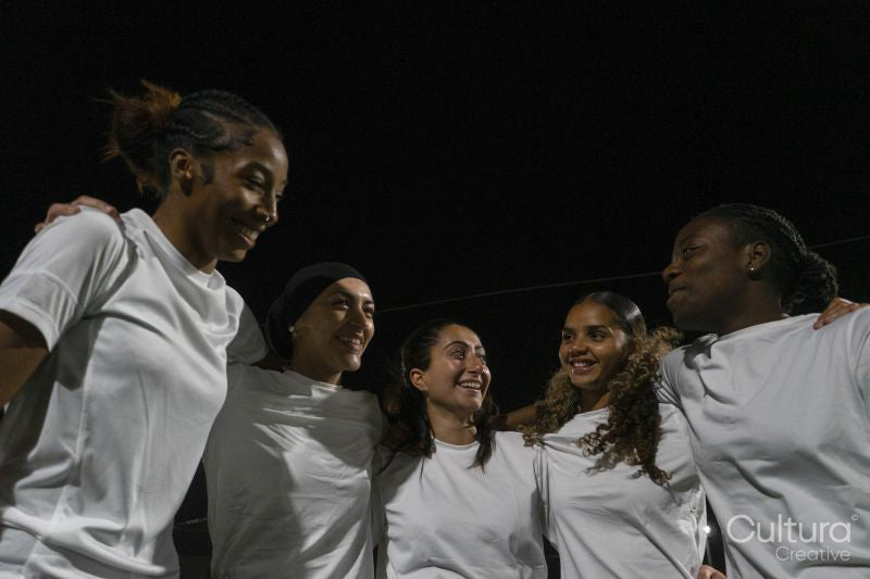 Female soccer players teaming up