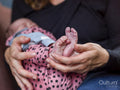 Close-up of woman holding baby son
