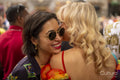 Two affectionate women in crowd