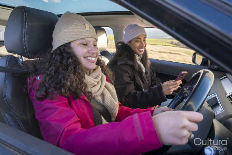 Female friends traveling by car