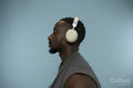 Profile of man wearing headphones and listening to music