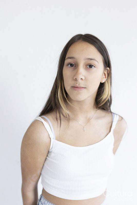 Portrait of serious girl on white background